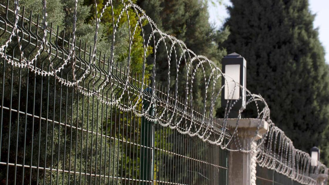 Compound wall, razor wire fencing